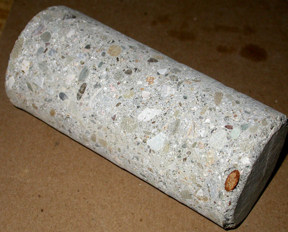 Compressive strength of core specimens drilled from concrete test
